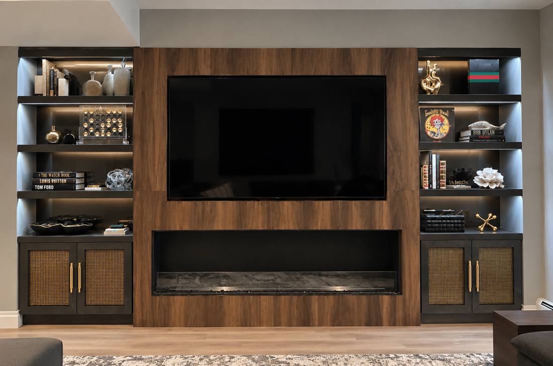 Walnut media wall with lit display shelving and cane-front cabinets
